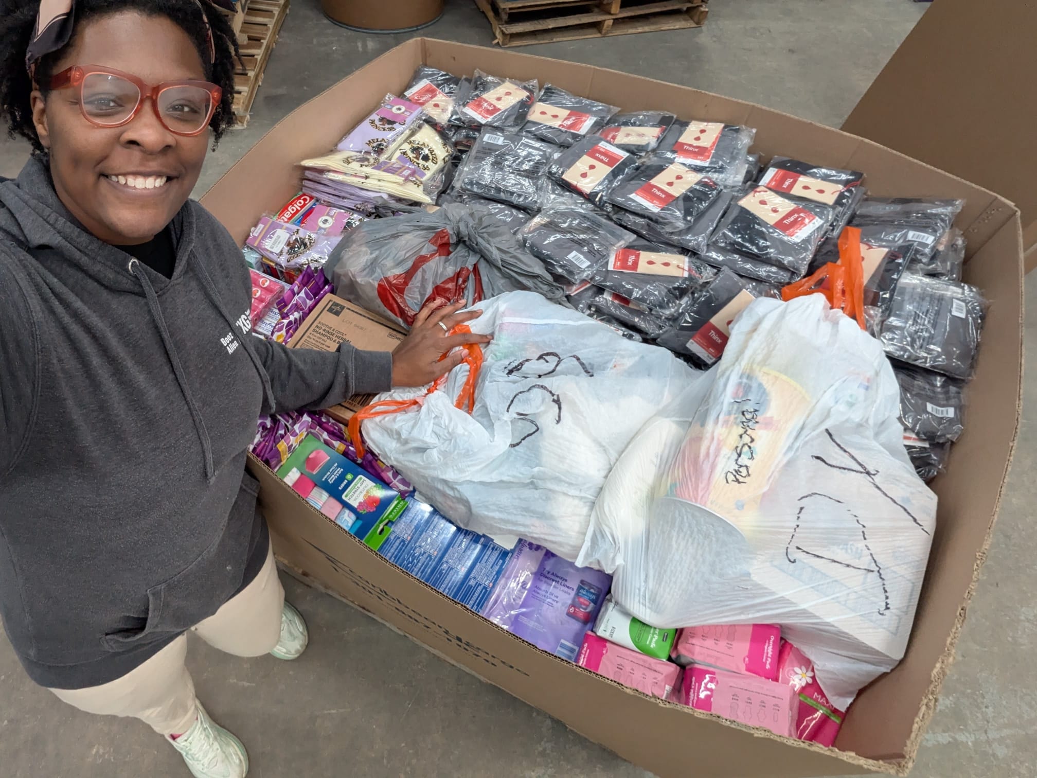 Jynnah with donations packed and ready to ship to Jamaica