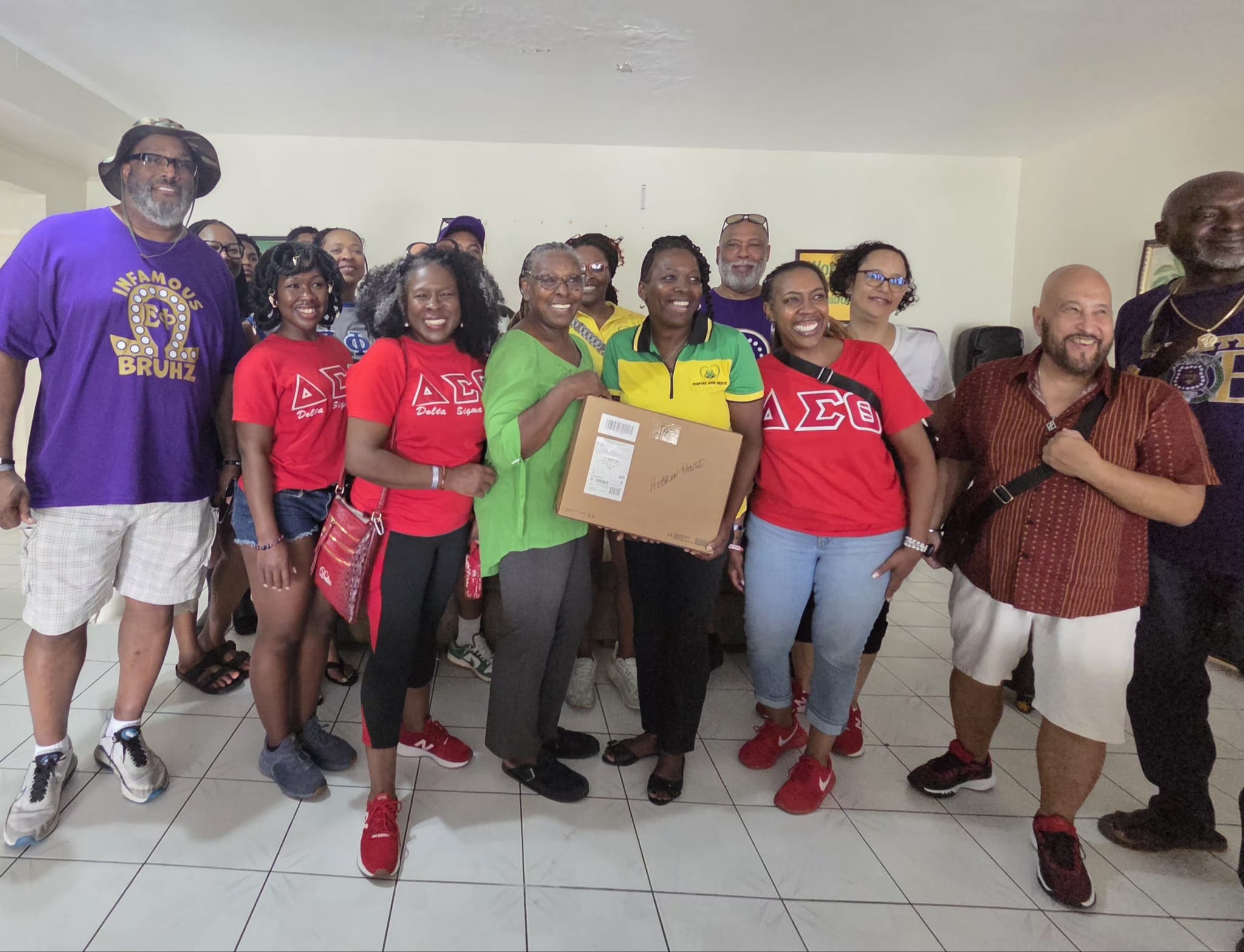 Gifting Hebron House — volunteers presenting donation box